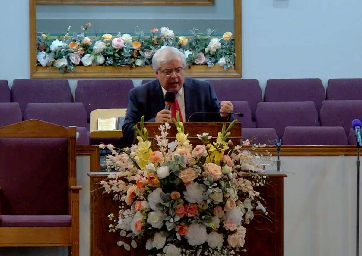 Willard Griffin preaching.
