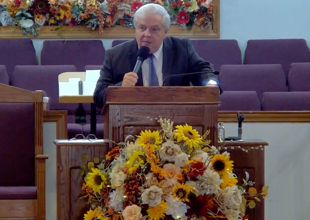 Willard Griffin preaching.