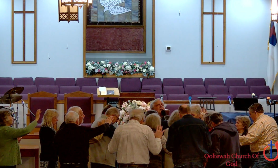 Church members praying together.