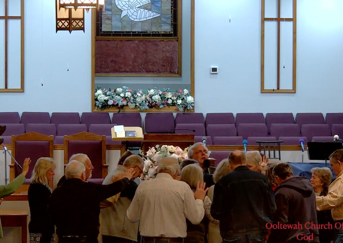 Church members praying together.