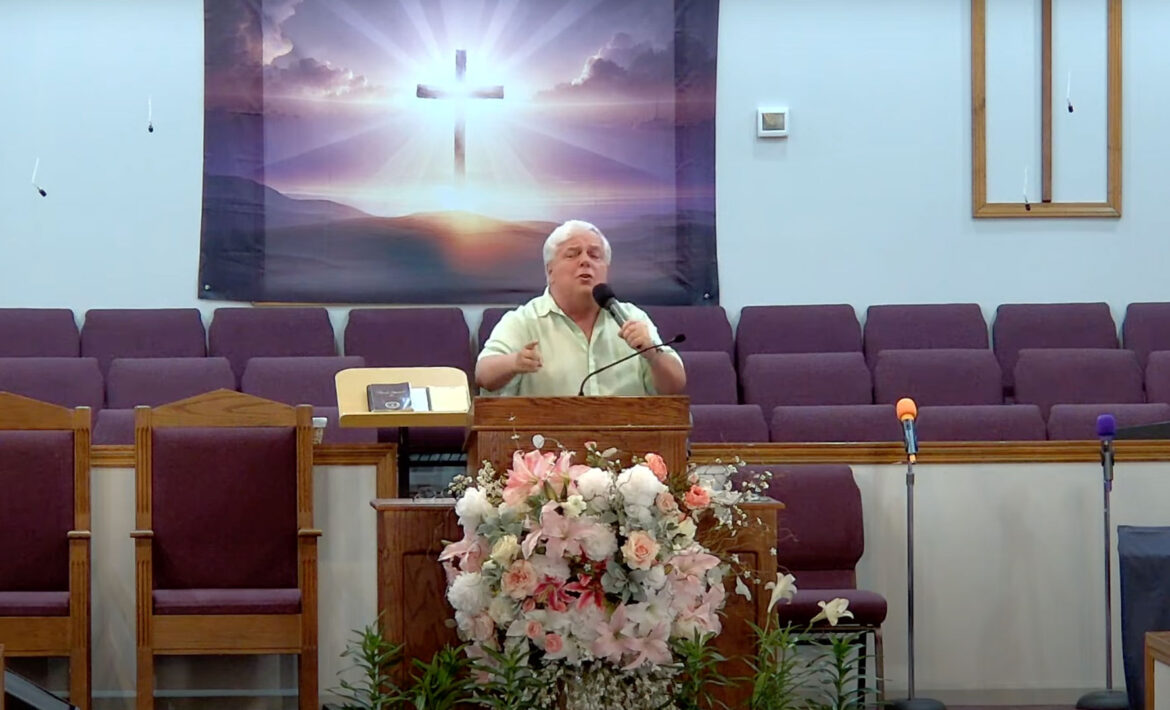 Willard Griffin preaching.