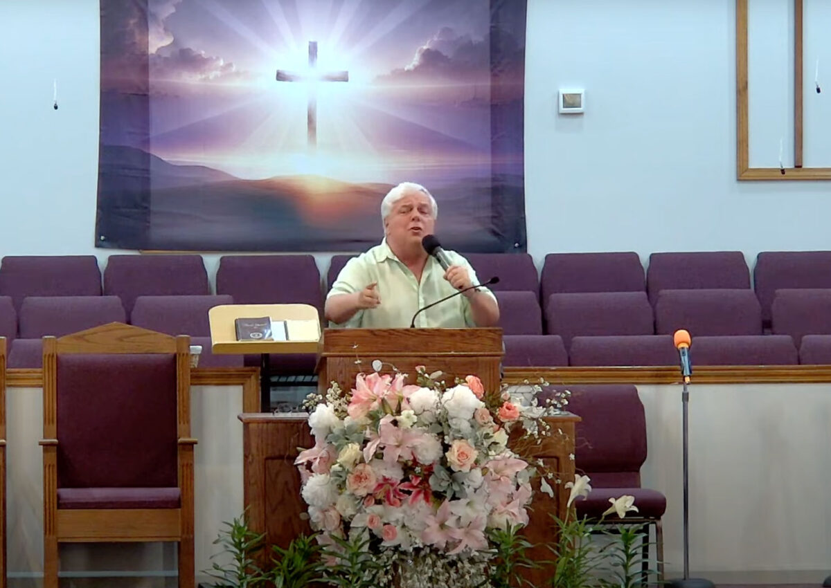 Willard Griffin preaching.
