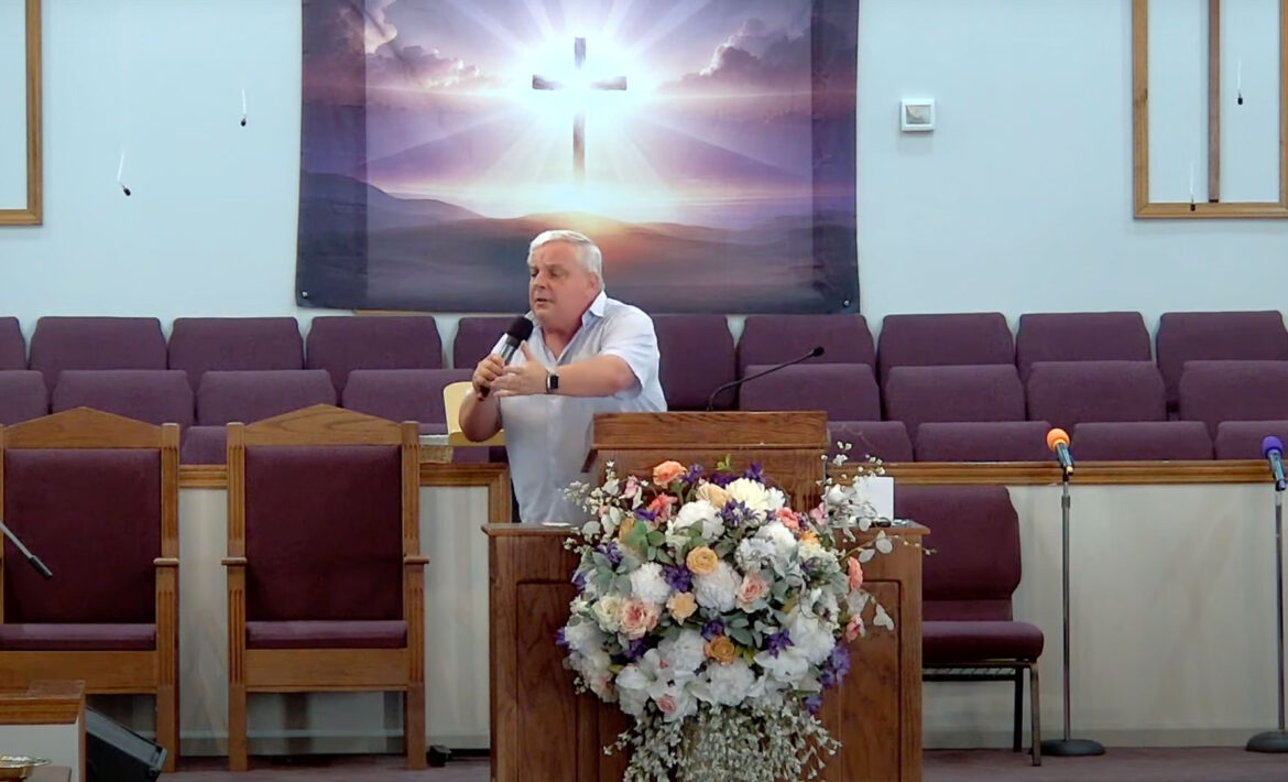Willard Griffin preaching.