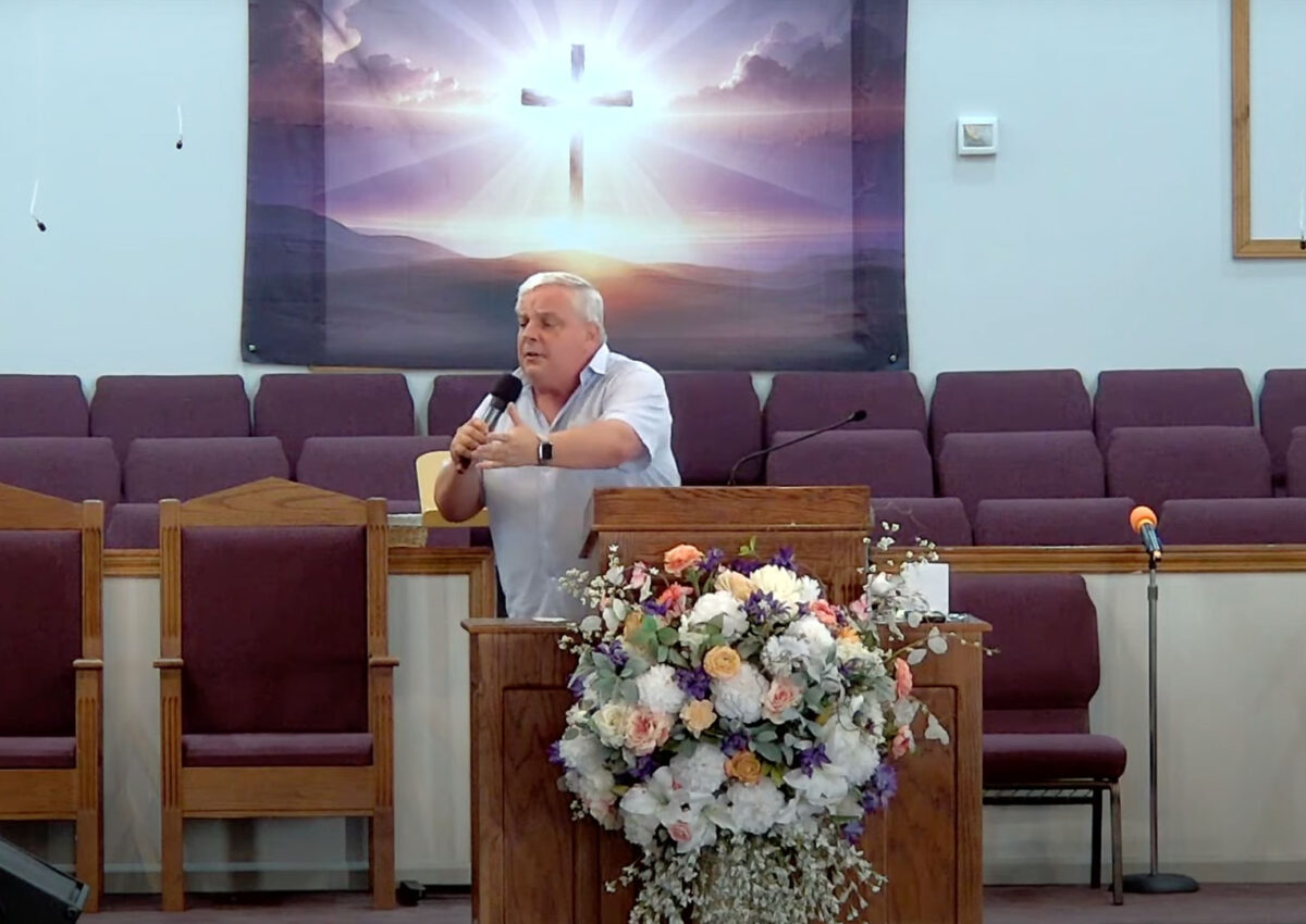 Willard Griffin preaching.