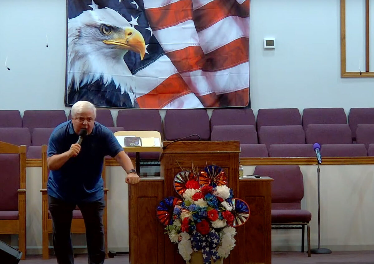 Willard Griffin preaching.