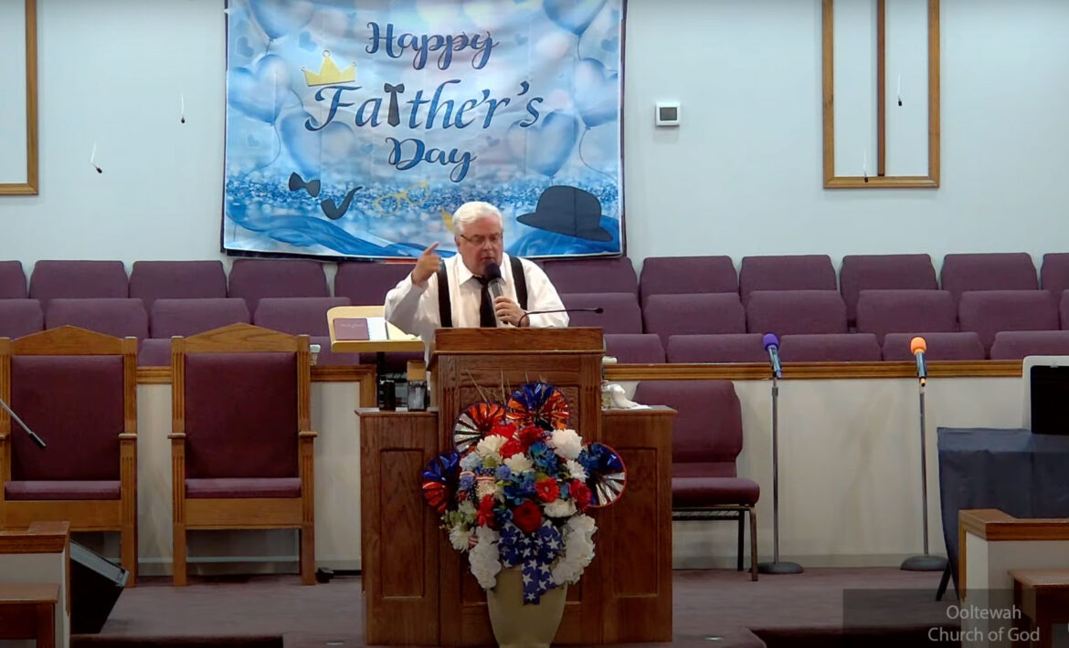 Willard Griffin preaching.