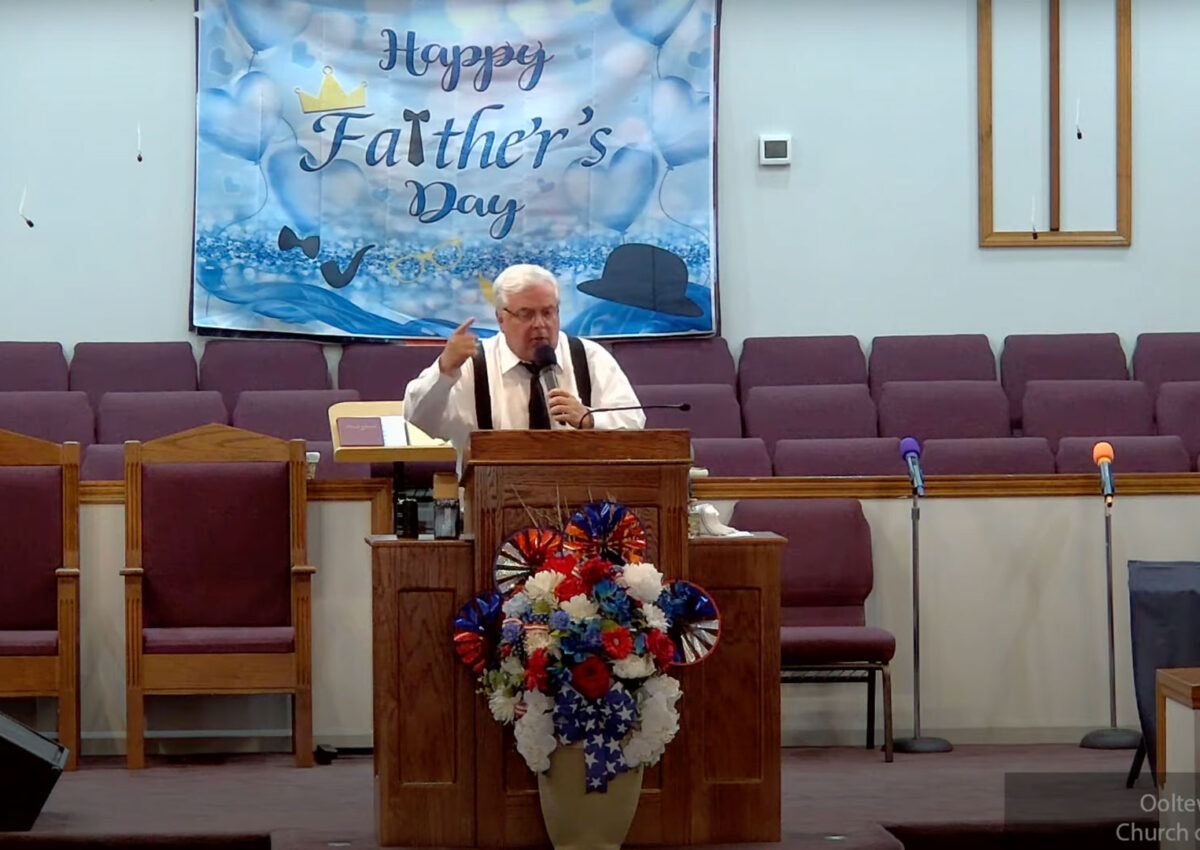 Willard Griffin preaching.