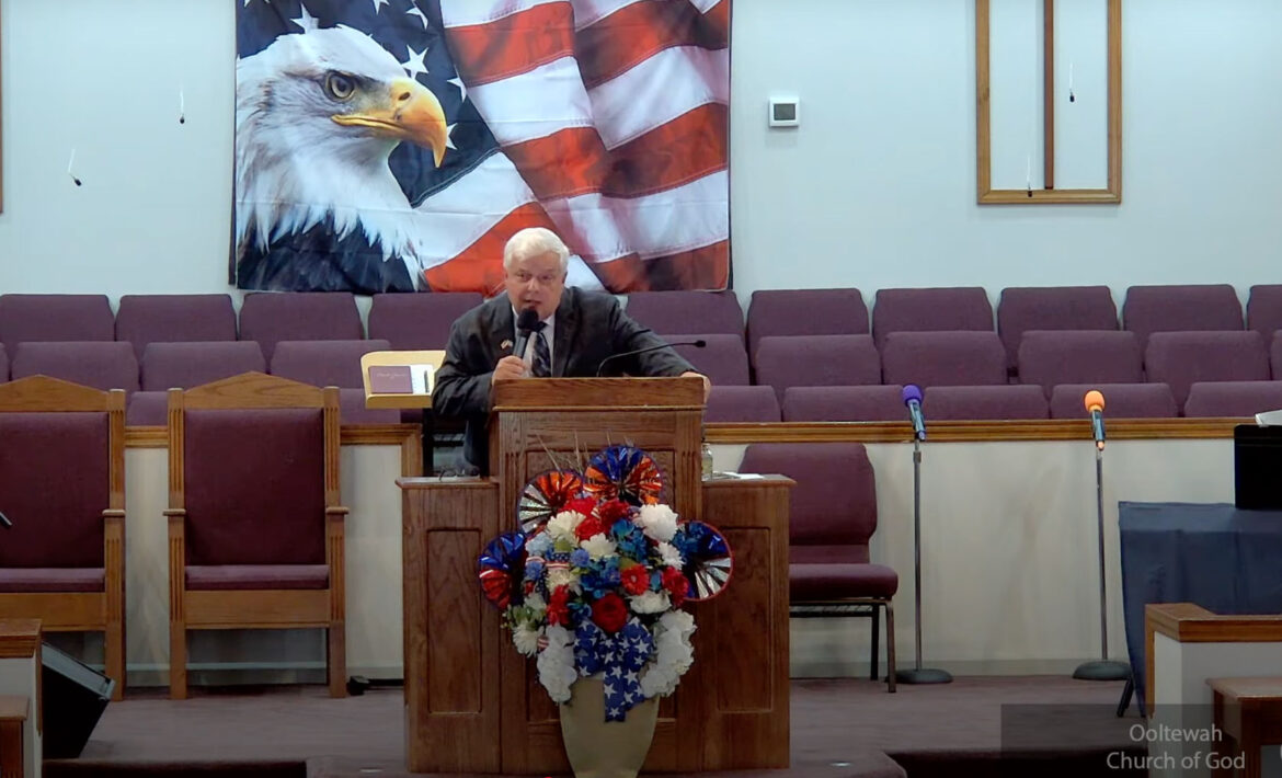 Willard Griffin preaching.