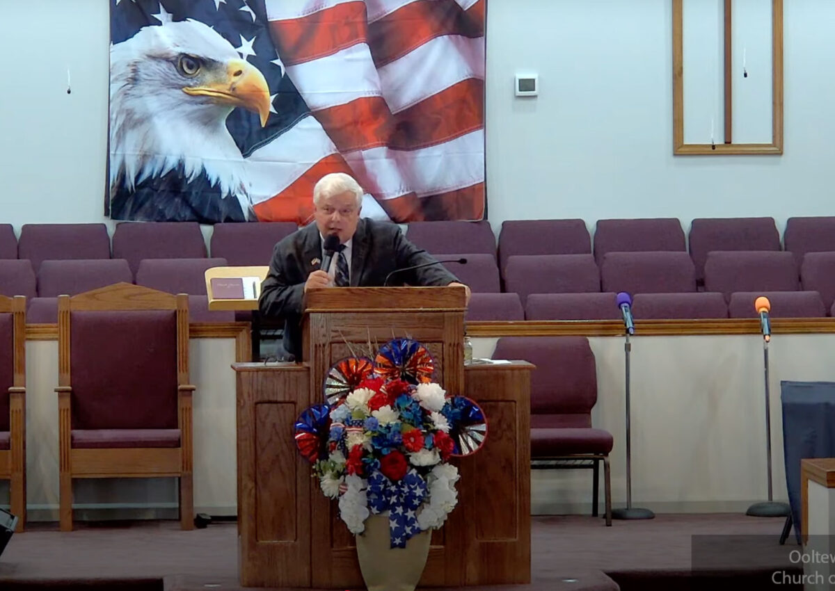 Willard Griffin preaching.