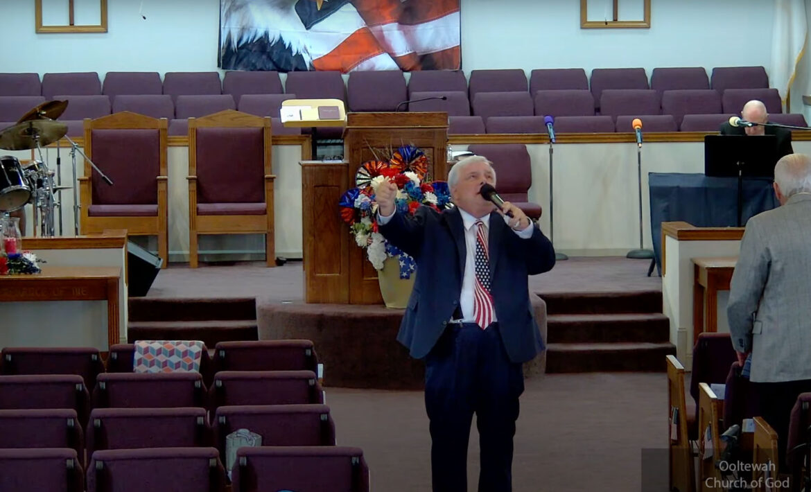 Willard Griffin preaching.