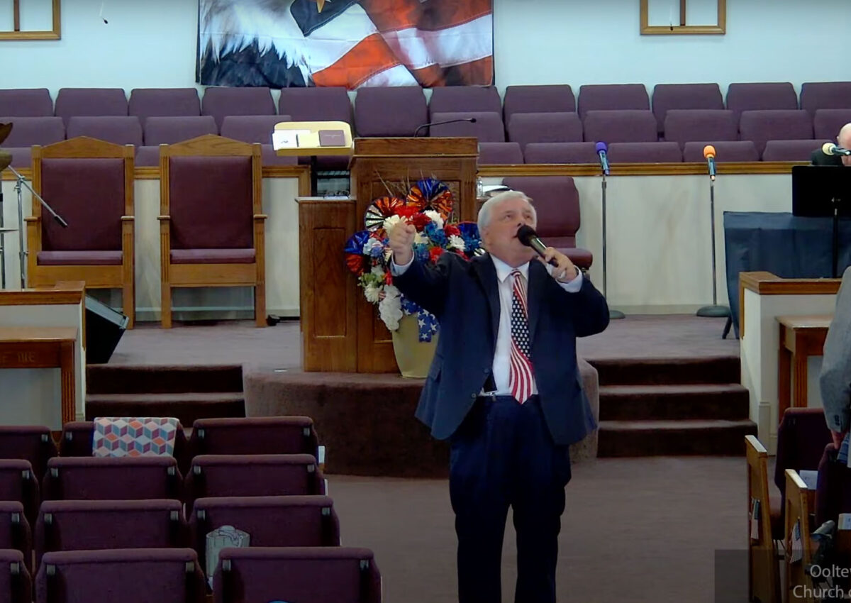 Willard Griffin preaching.