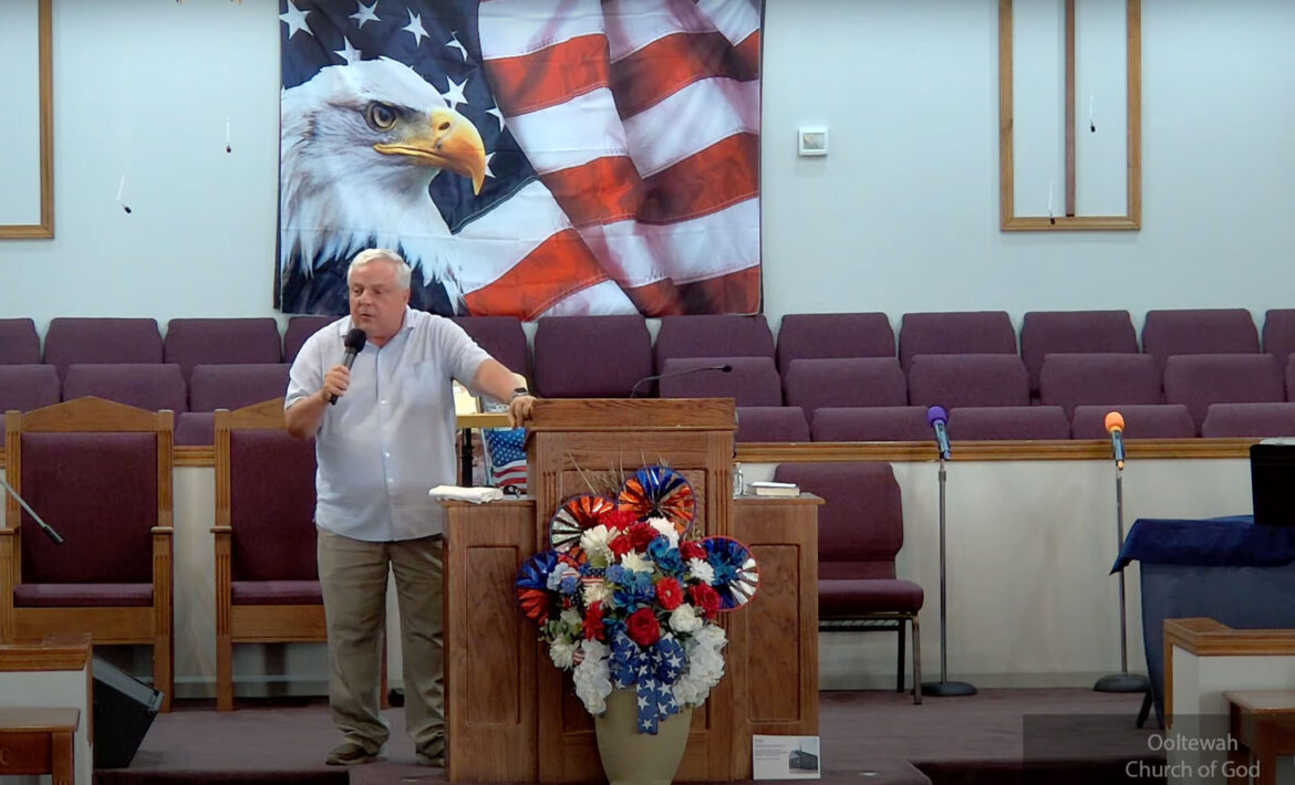 Willard Griffin preaching.