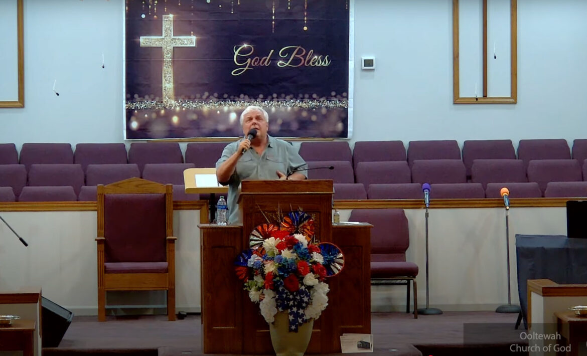 Willard Griffin preaching.