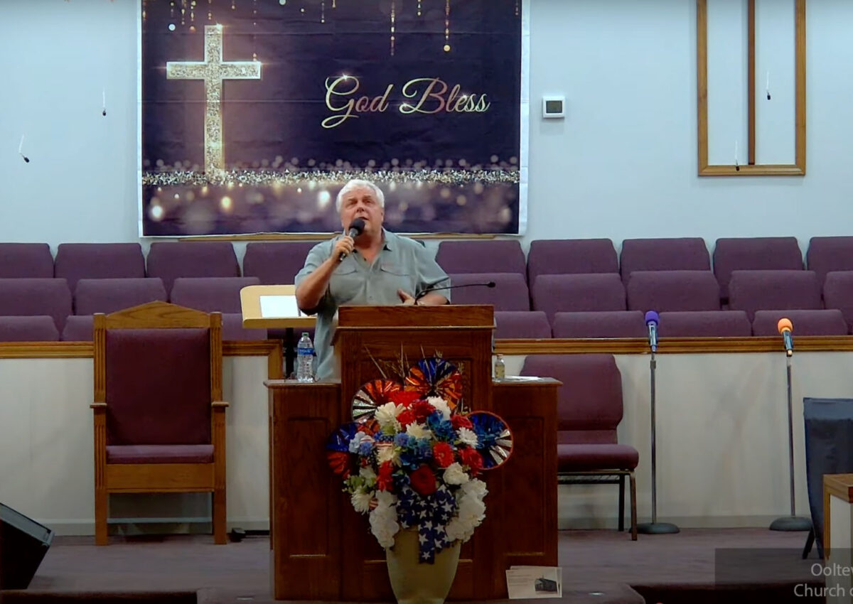 Willard Griffin preaching.