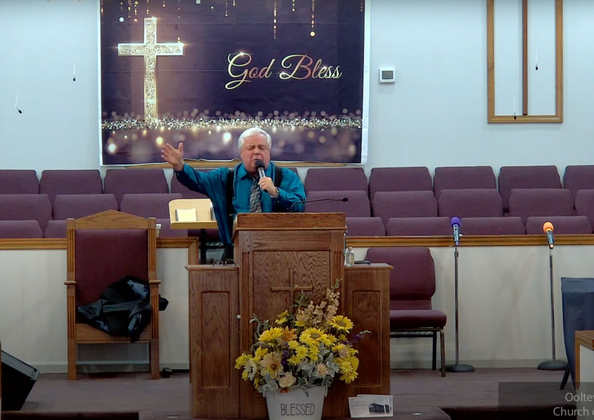 Willard Griffin preaching.