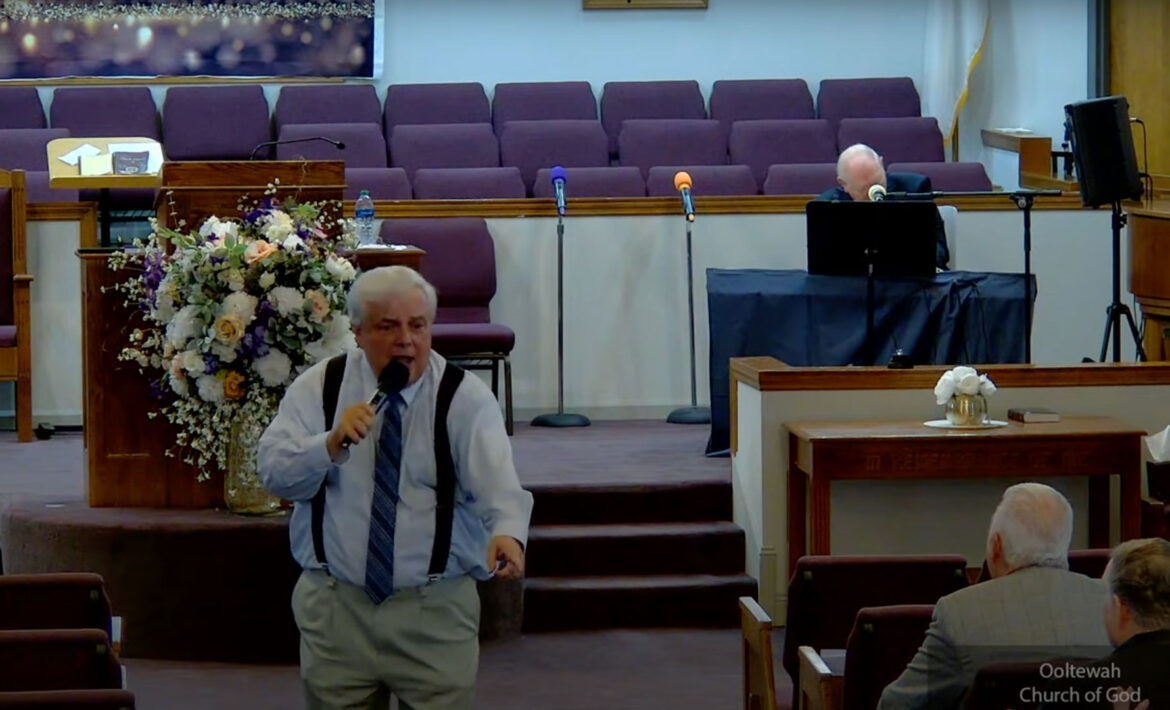 Willard Griffin preaching.
