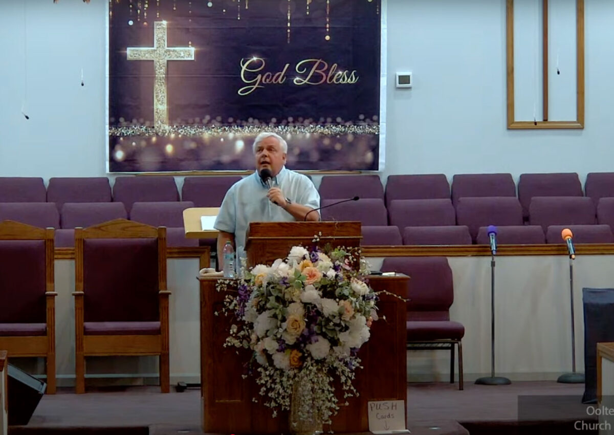 Willard Griffin preaching.