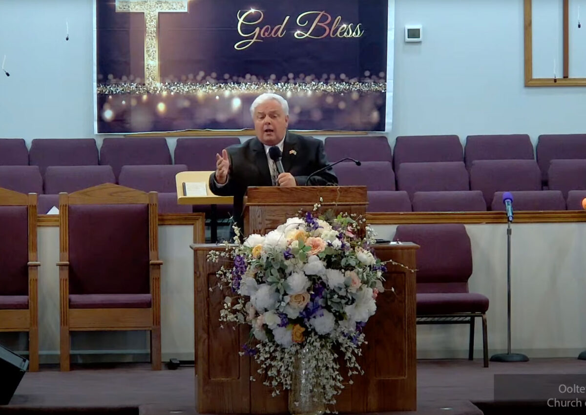 Willard Griffin preaching.