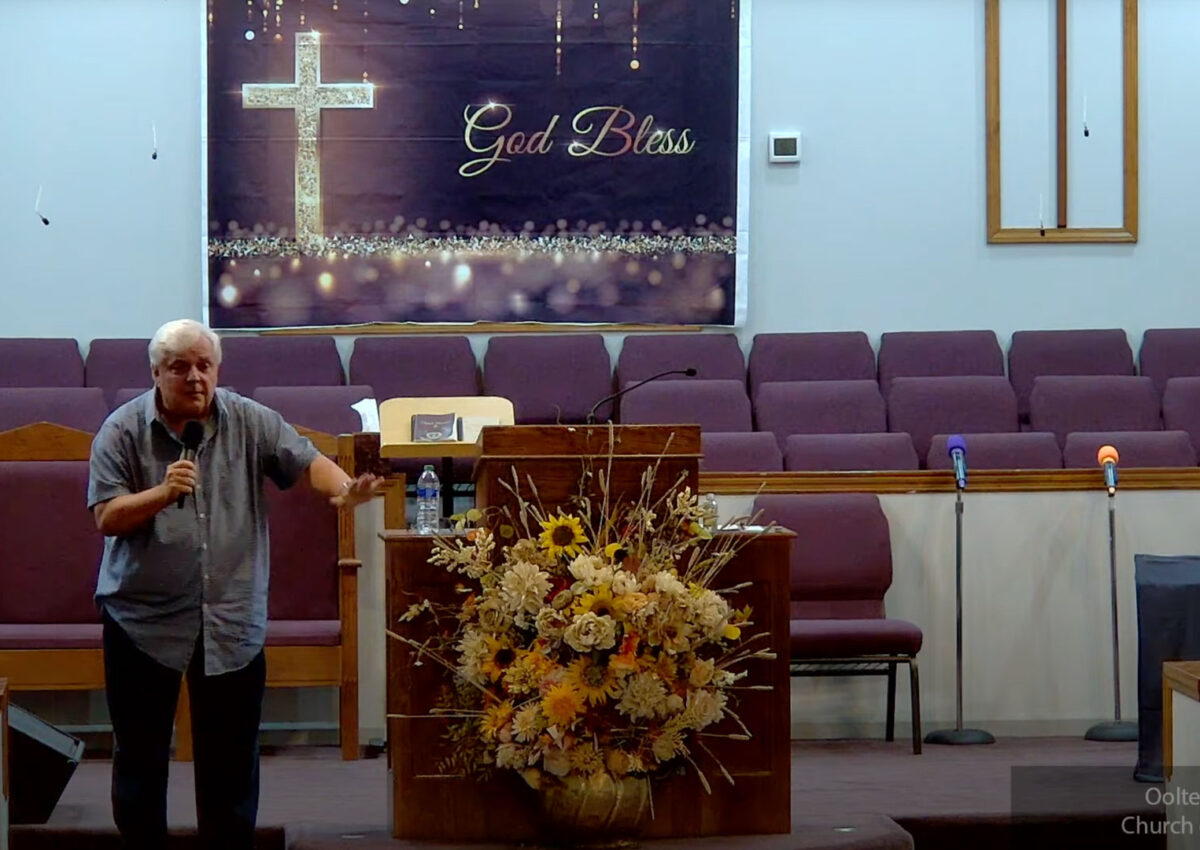 Willard Griffin preaching.