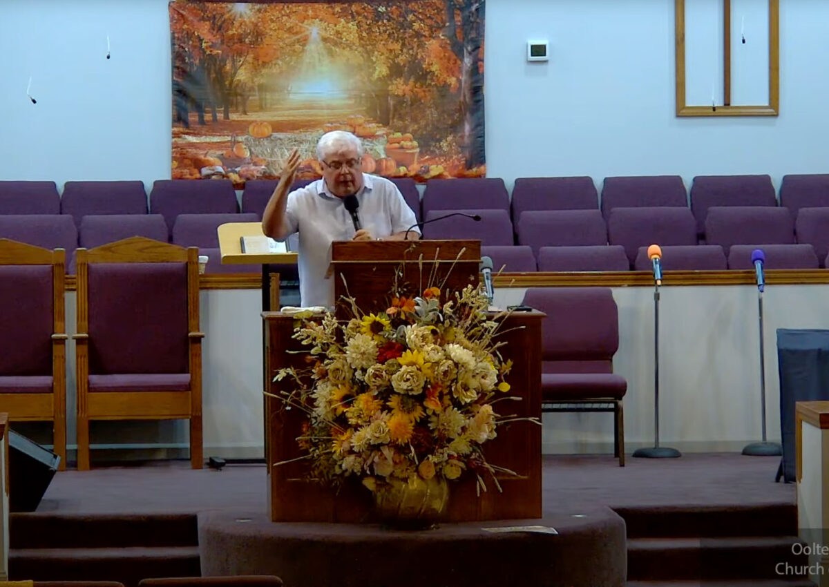Willard Griffin preaching.