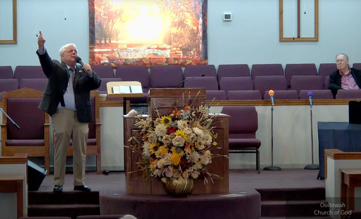 Willard Griffin preaching.
