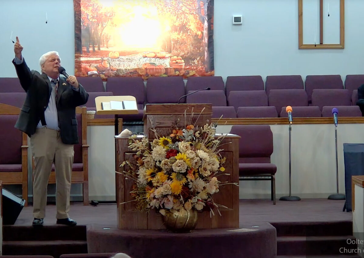 Willard Griffin preaching.
