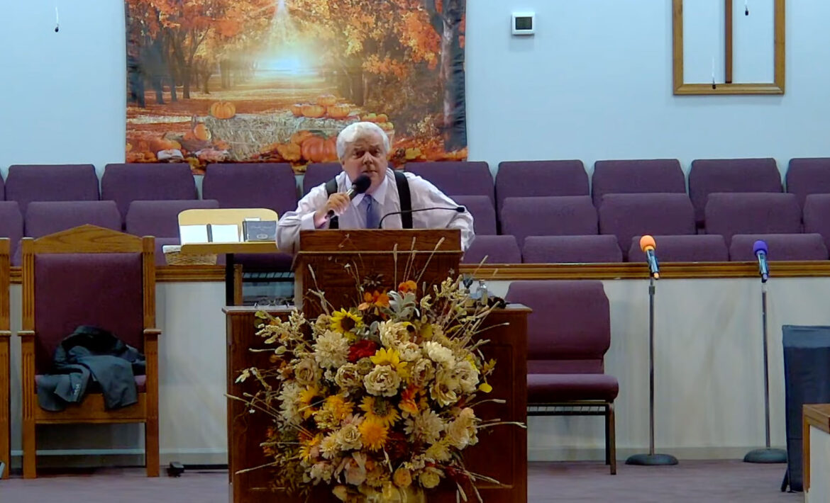 Willard Griffin preaching.