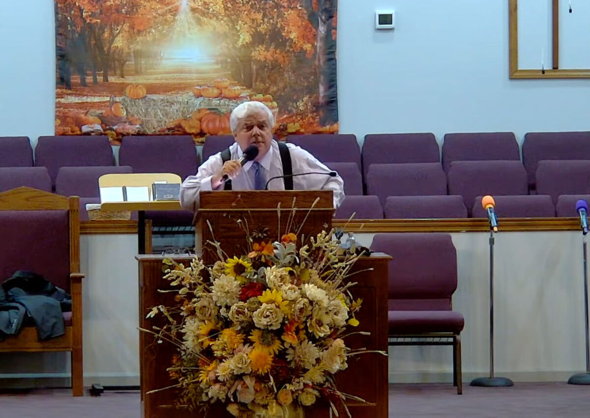 Willard Griffin preaching.