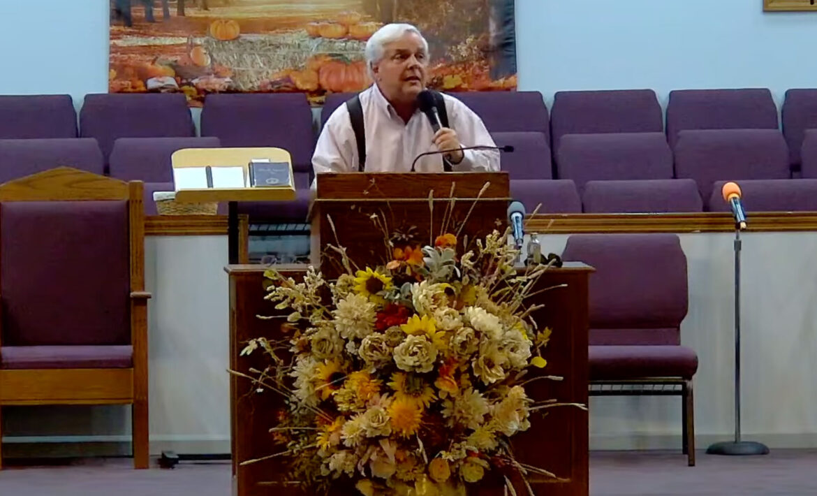 Willard Griffin preaching.