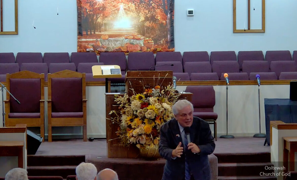 Willard Griffin preaching.