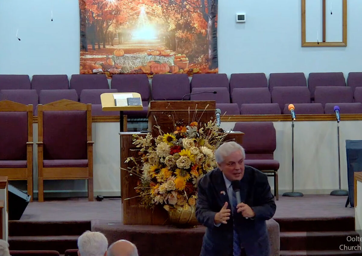 Willard Griffin preaching.