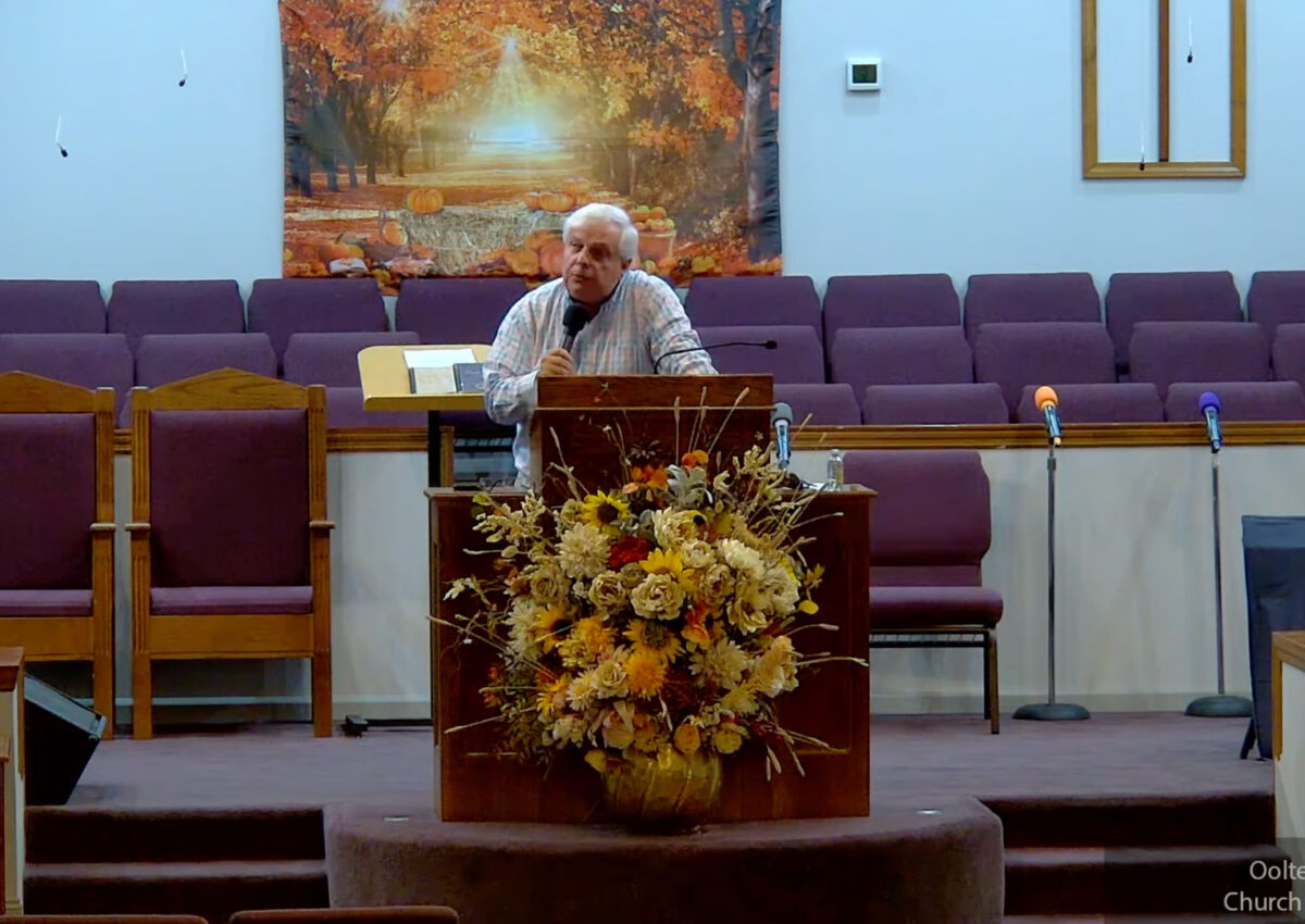 Willard Griffin preaching.