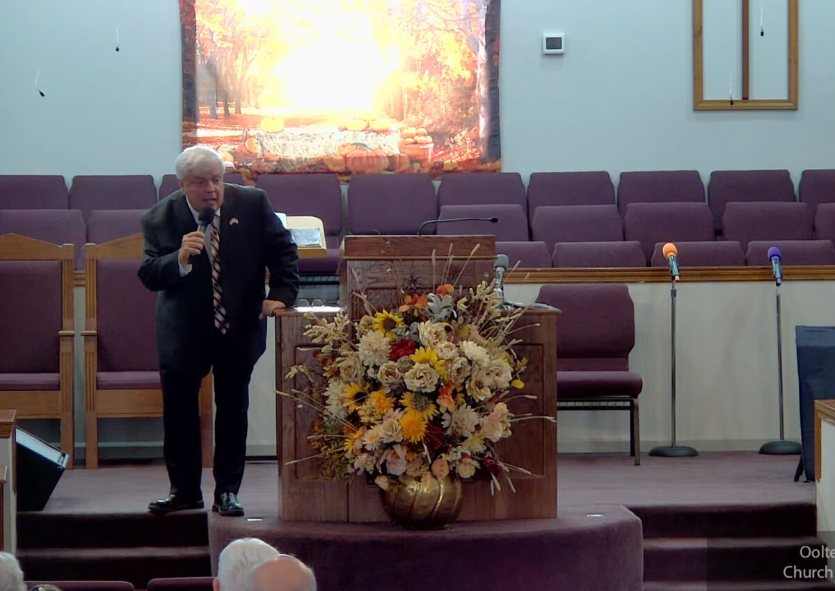 Willard Griffin preaching.