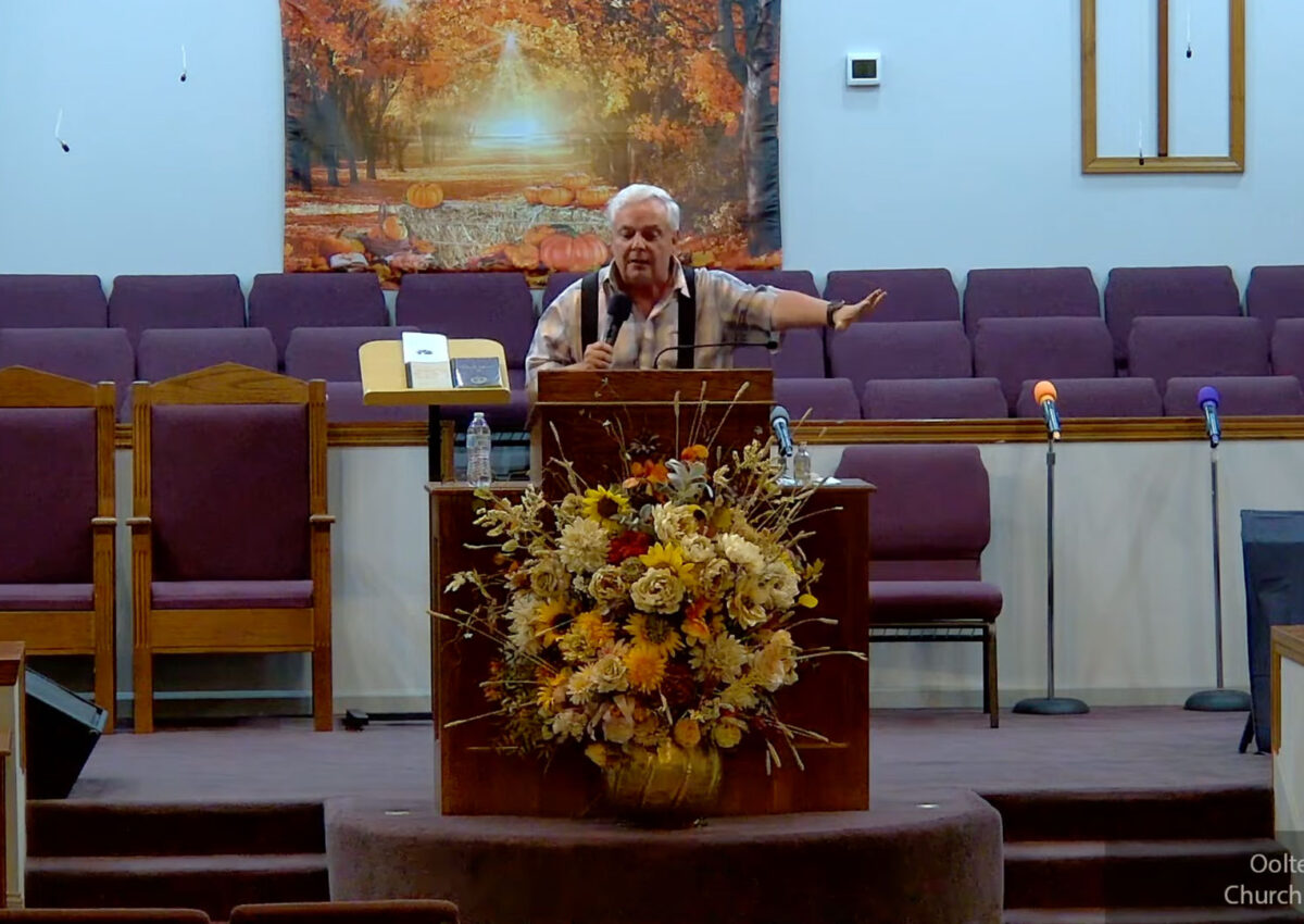 Willard Griffin preaching.