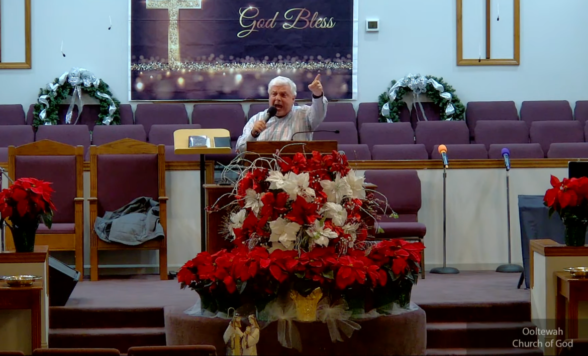 Willard Griffin preaching.