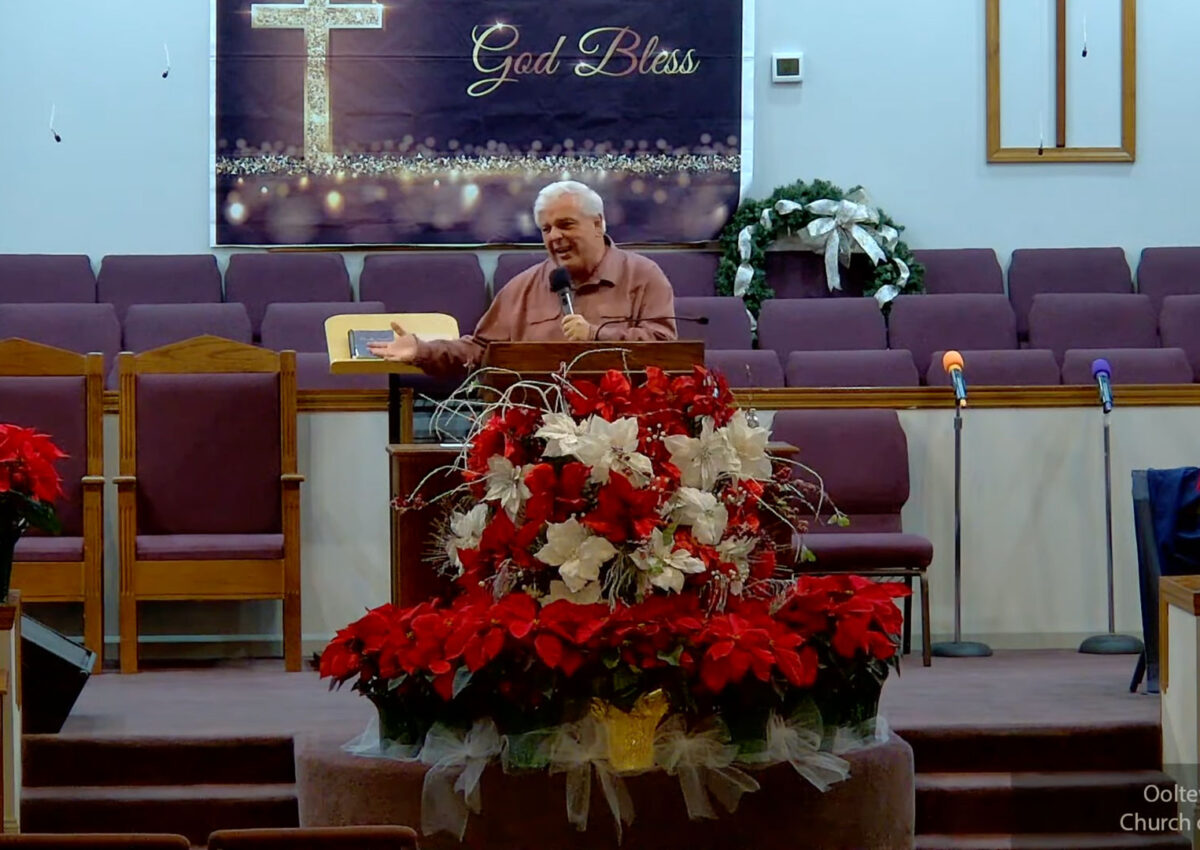 Willard Griffin preaching.