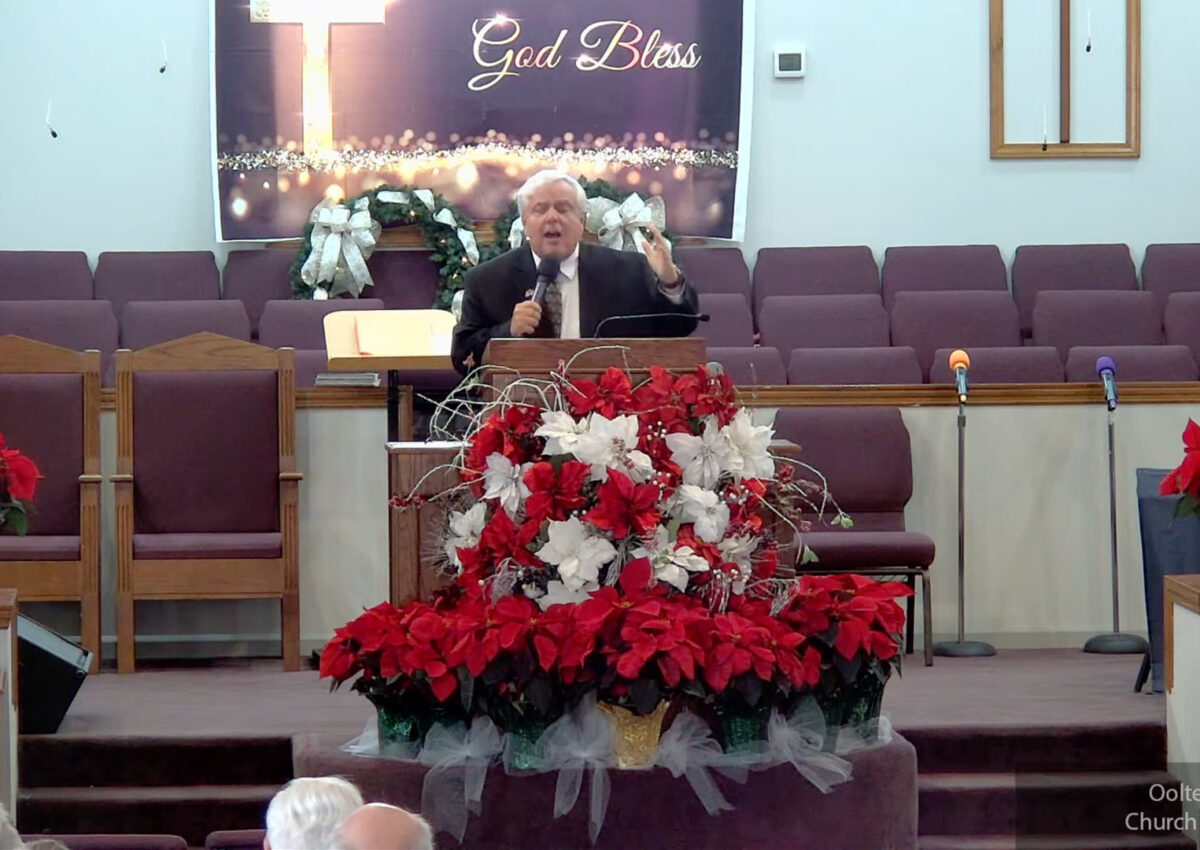 Willard Griffin preaching.