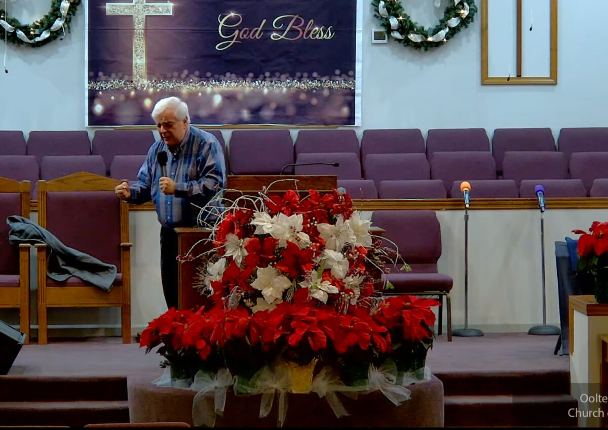 Willard Griffin preaching.