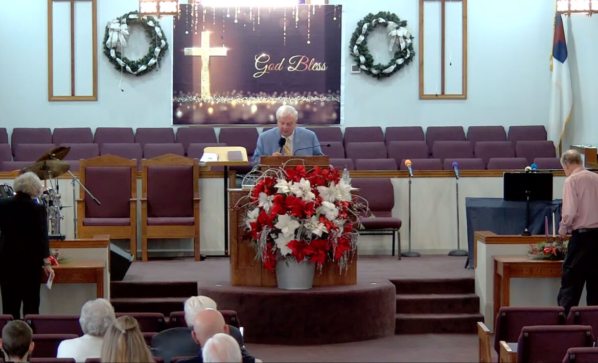 Willard Griffin preaching.