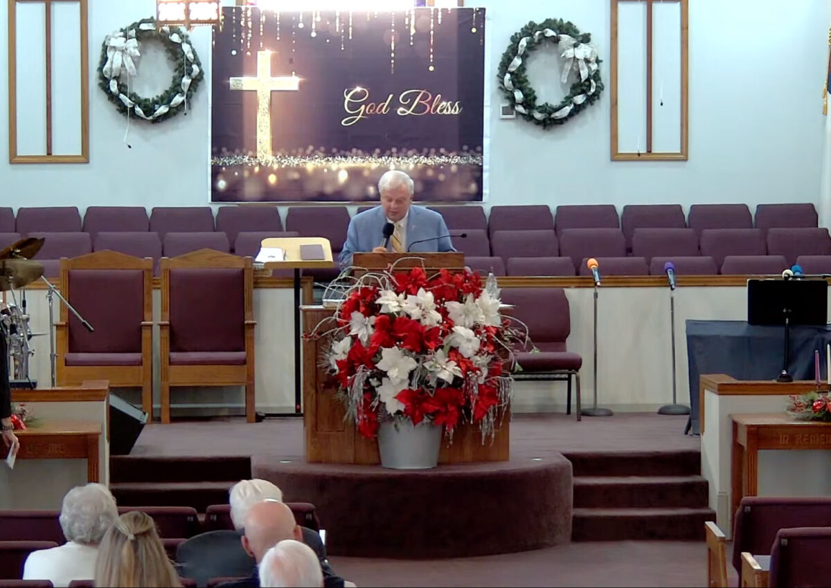 Willard Griffin preaching.