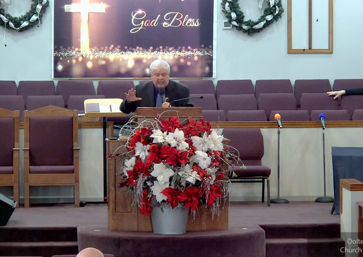 Willard Griffin preaching.