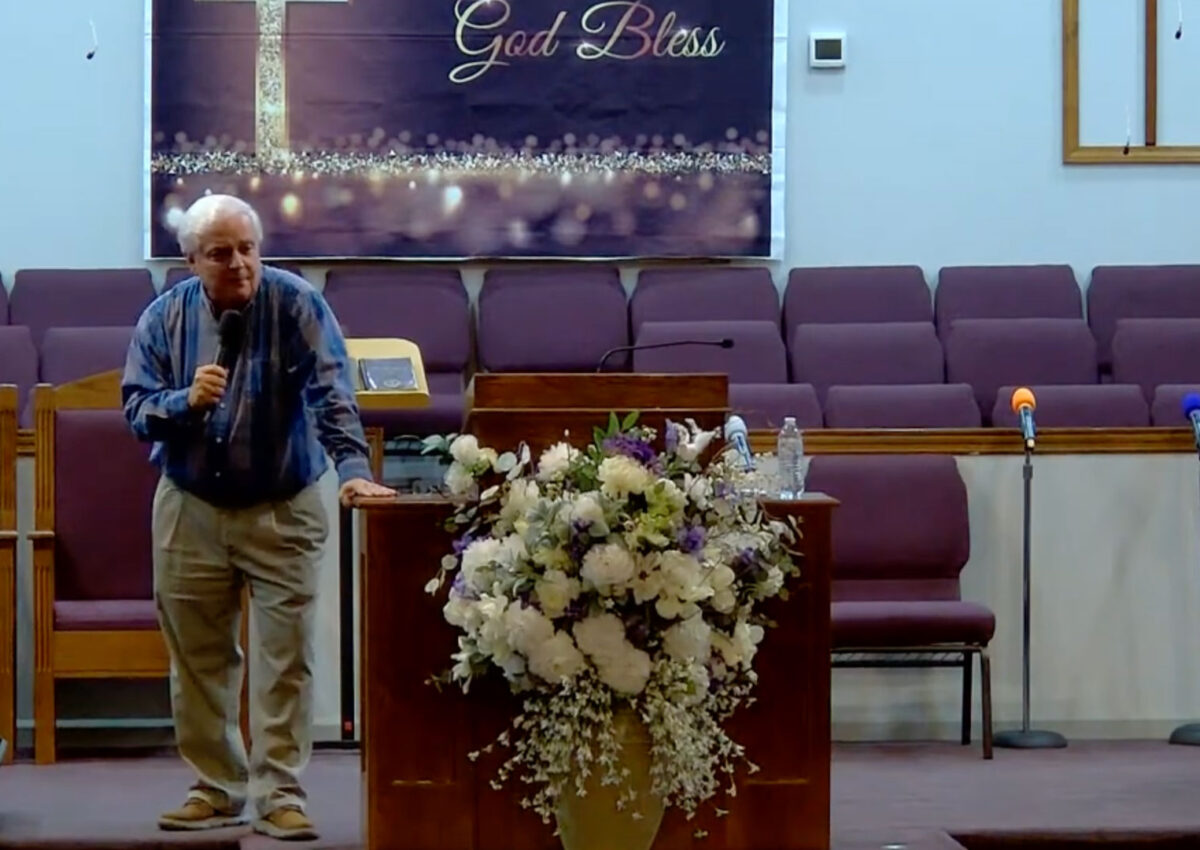 Willard Griffin preaching.