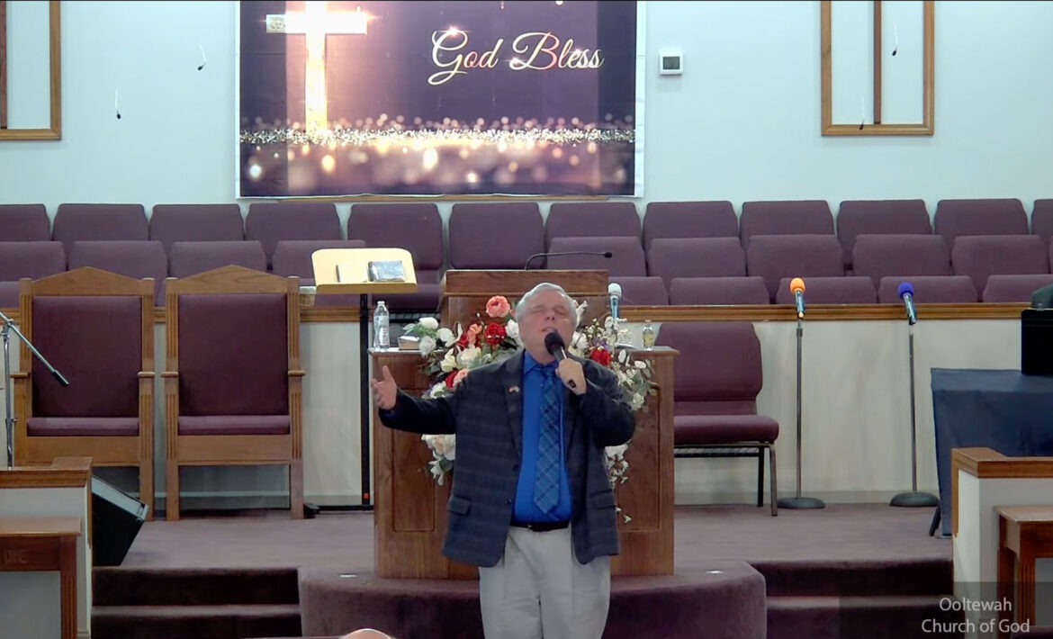 Willard Griffin preaching.