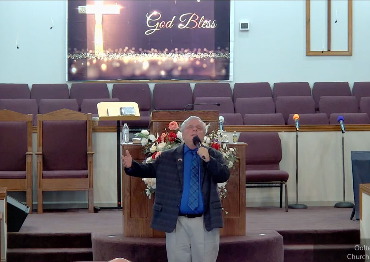 Willard Griffin preaching.