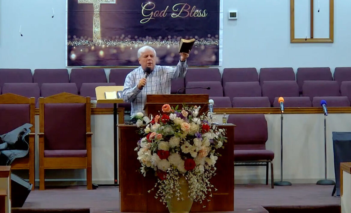 Willard Griffin preaching.