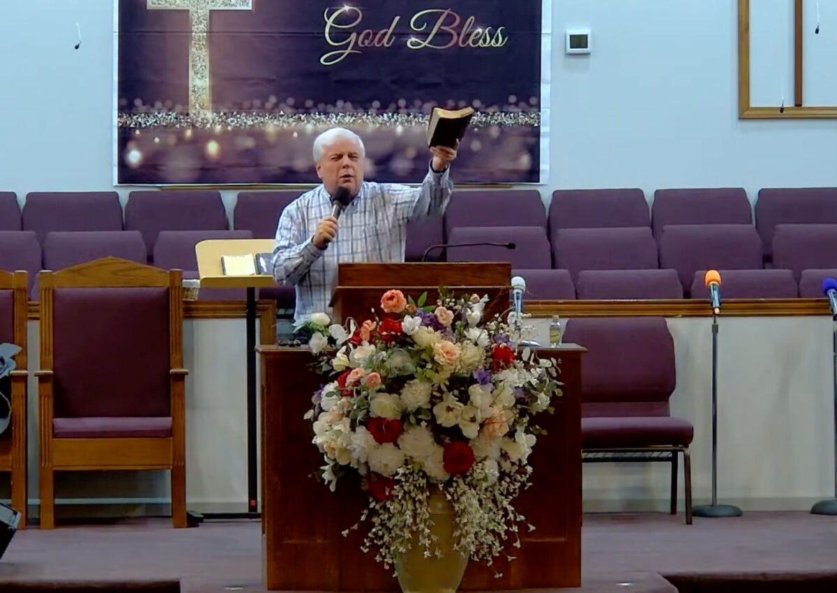 Willard Griffin preaching.