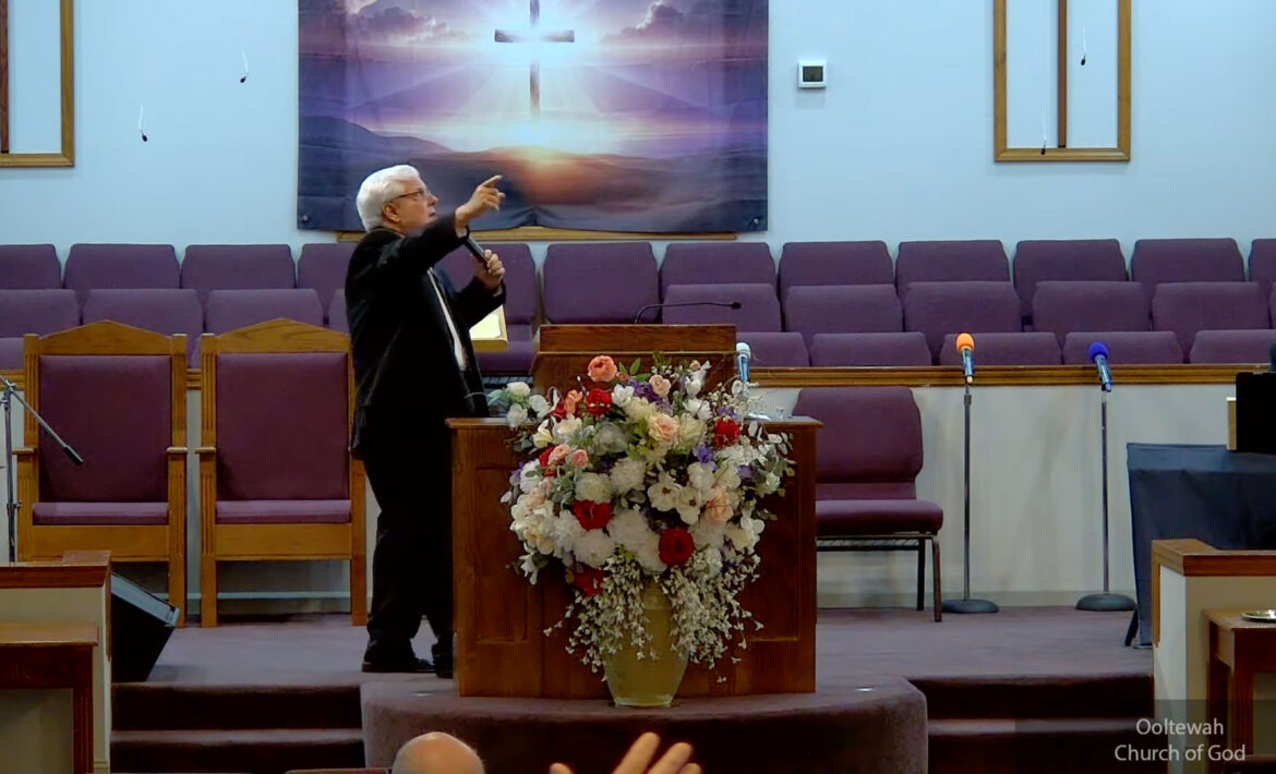 Willard Griffin preaching.