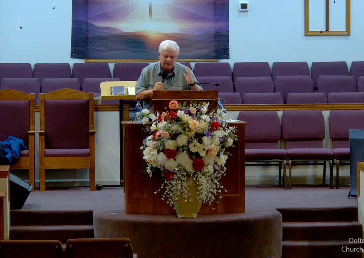 Willard Griffin preaching.