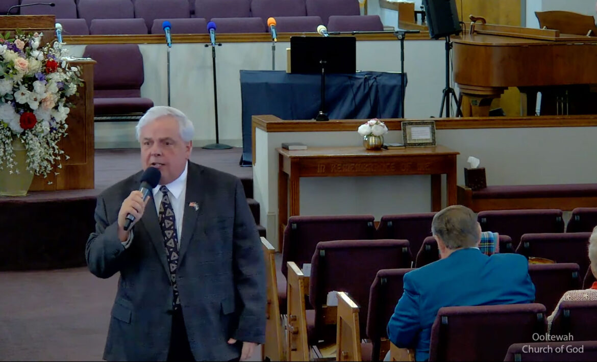 Willard Griffin preaching.