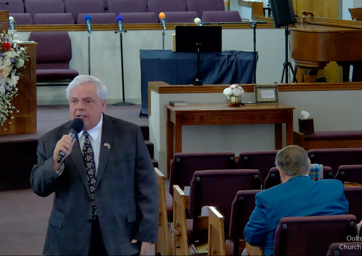 Willard Griffin preaching.